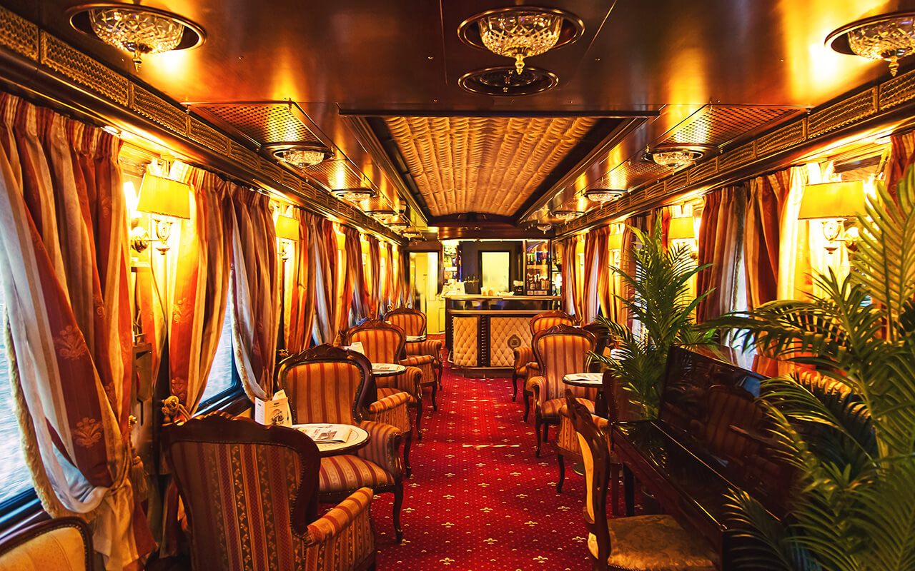 Interior of luxury vintage old train carriage. Retro train from the early 20th century.