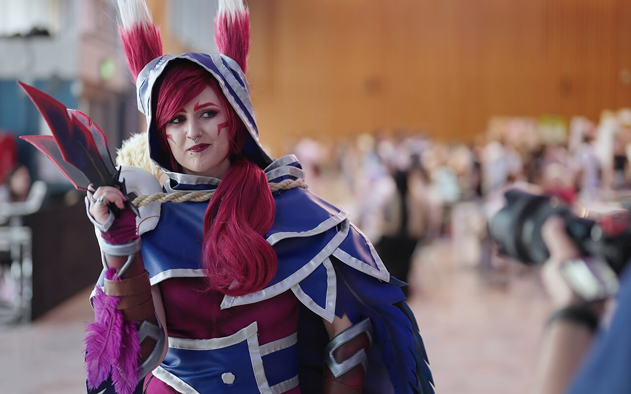 Cosplayer in costume with sword and ears