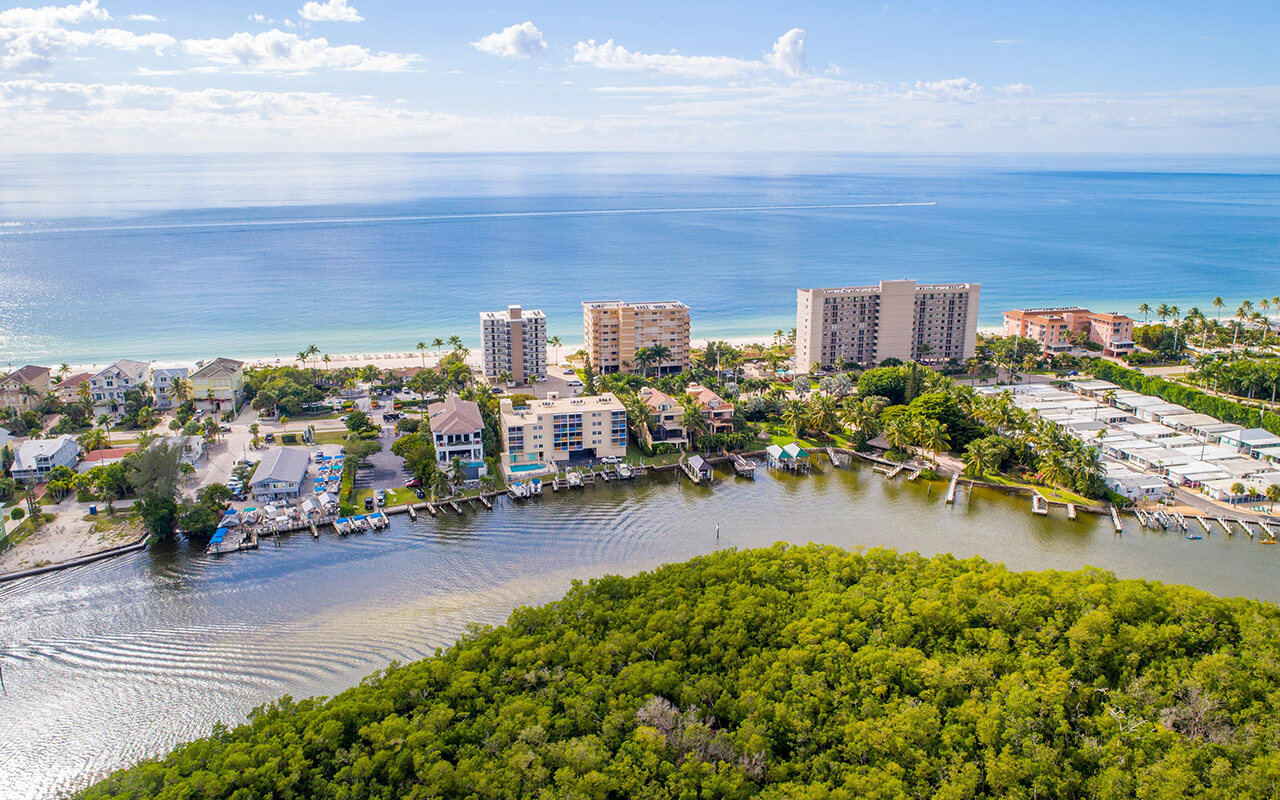 Aerial Drone View of Bonita Springs Beach, Florida with the Bay and Mangroves in the Foreground and the Gulf of Mexico in the Background