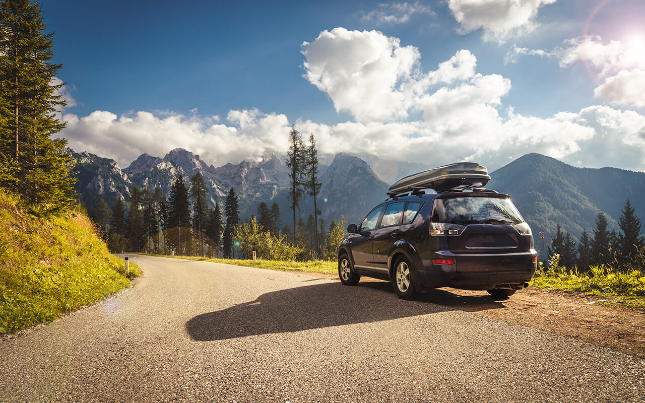 car for traveling with a mountain road
