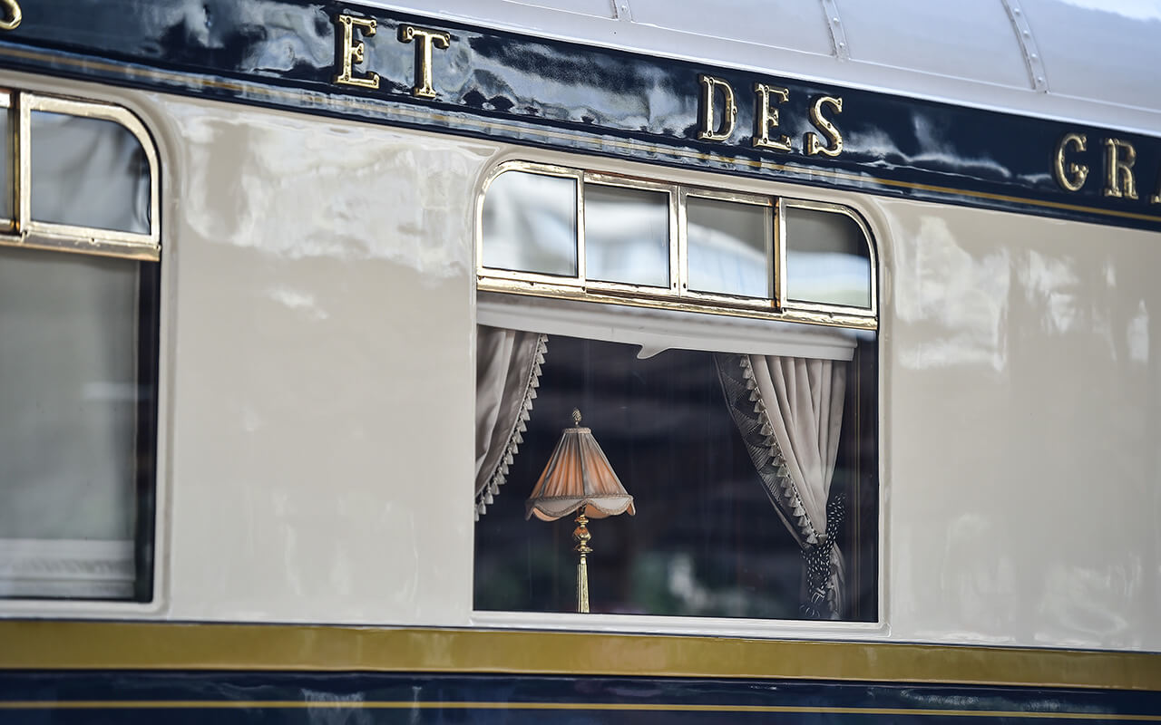 Famous Orient Express long distance passenger train stopped in Bucharest central train station.