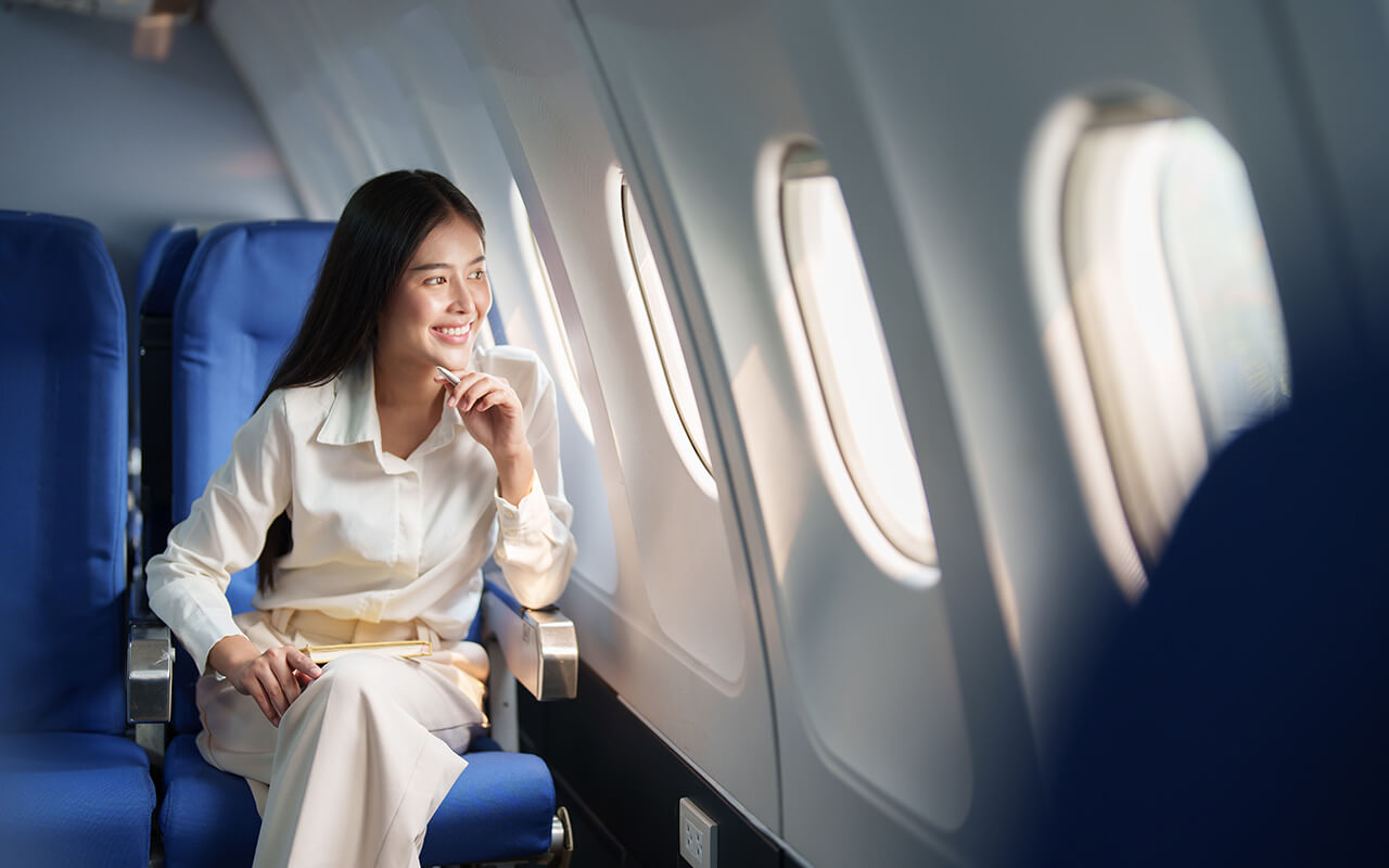 Airplane passenger looking out the window