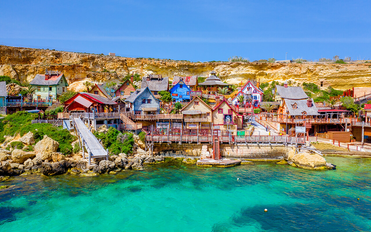 Malta, Il-Mellieha. View of the famous Popeye village Mellieha and bay on a sunny day