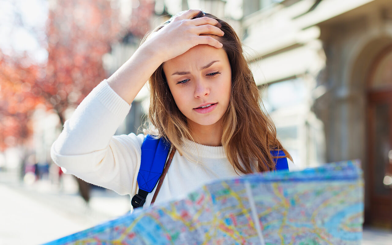 Woman looking confused at a map