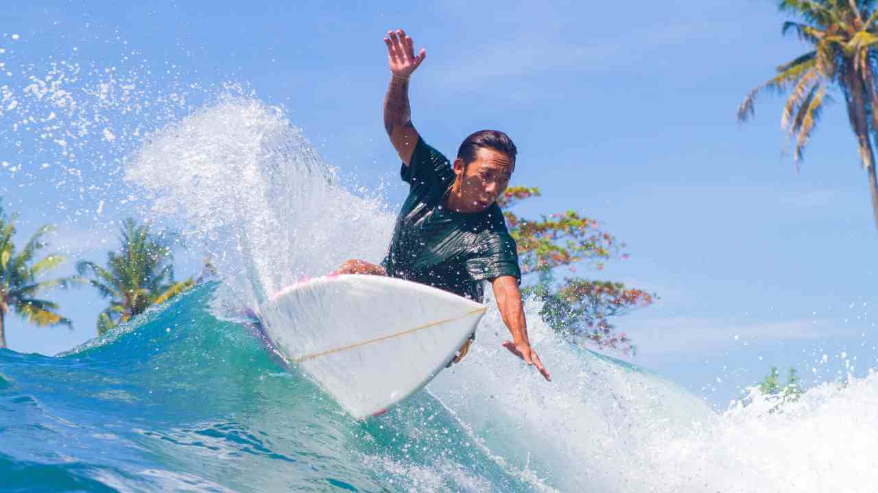 a surfer riding a wave in the ocean