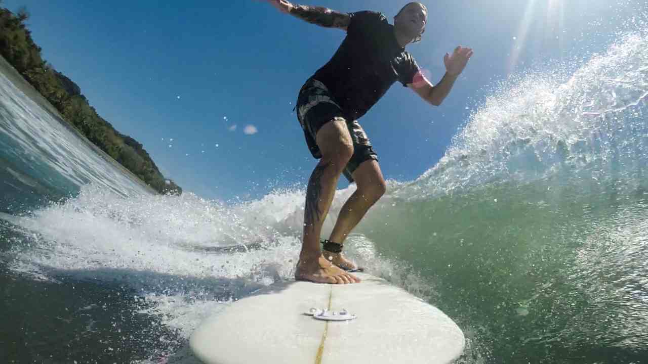 a person riding a wave on a surfboard