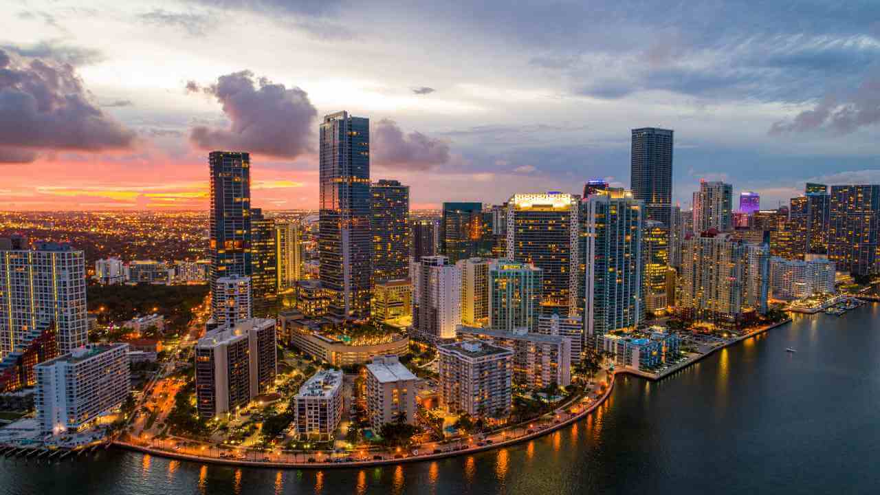 an aerial view of the miami skyline at sunset