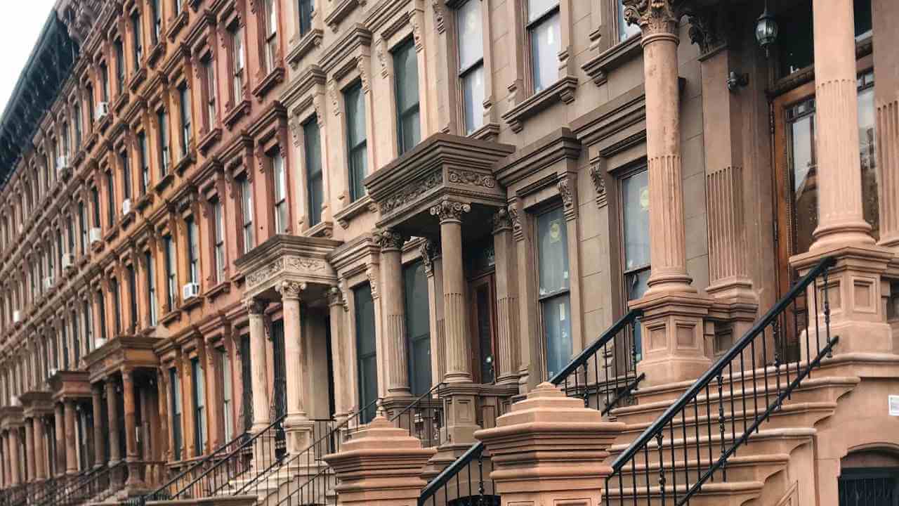 a row of brownstone buildings in new york city