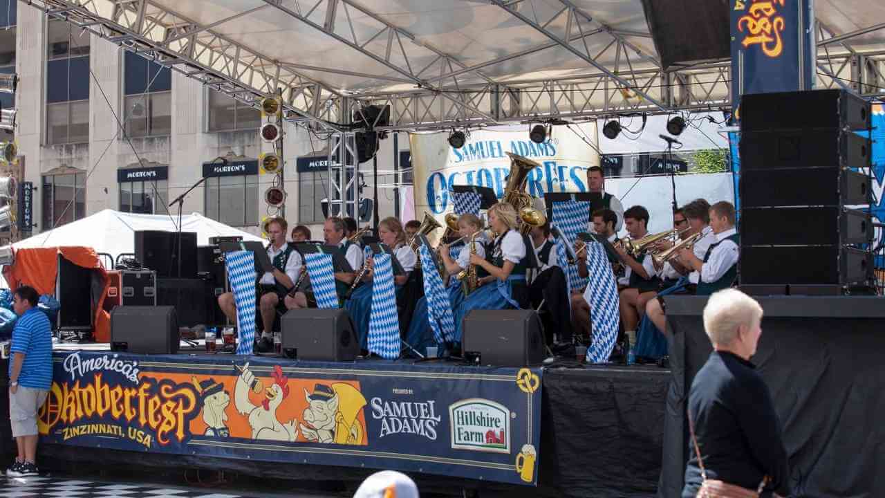 a group of people on stage at an outdoor event