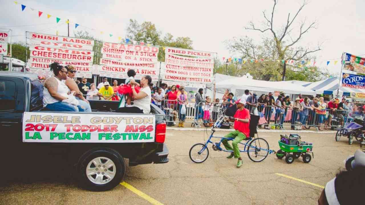 a group of people riding bicycles in a parade