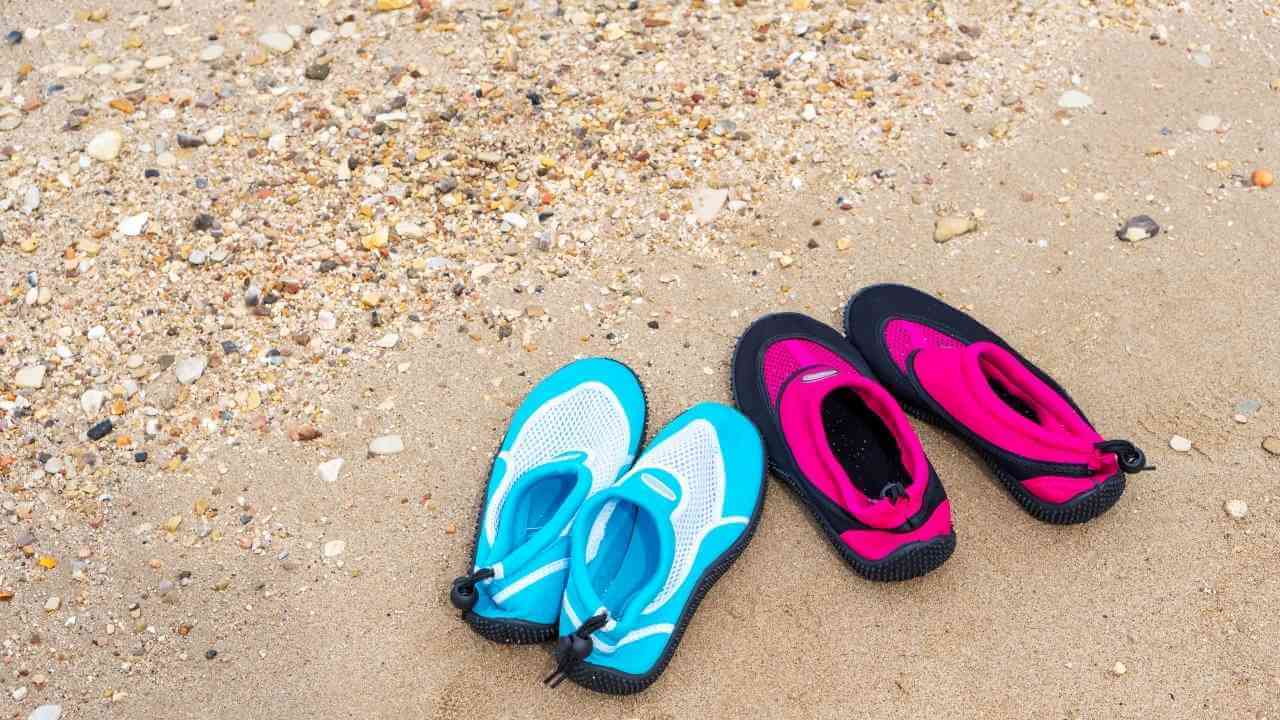 two pairs of sandals on the beach