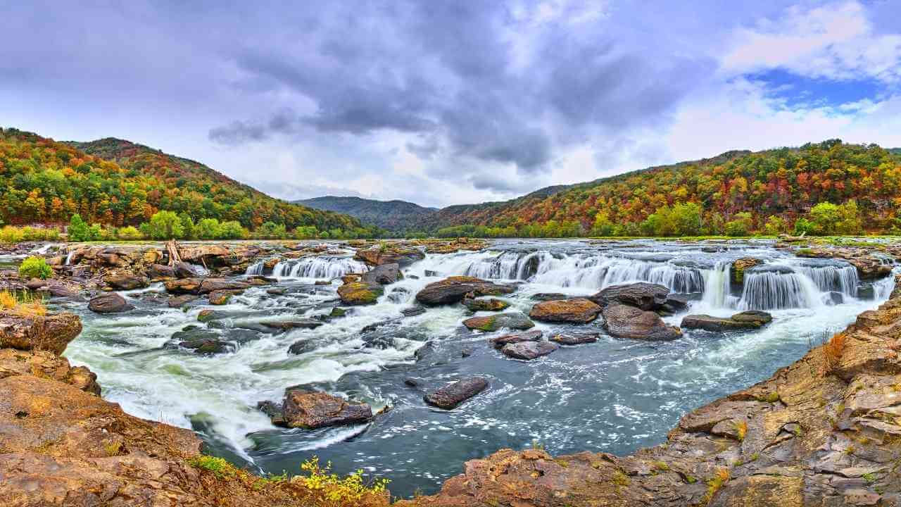 a view of a waterfall in the middle of a river