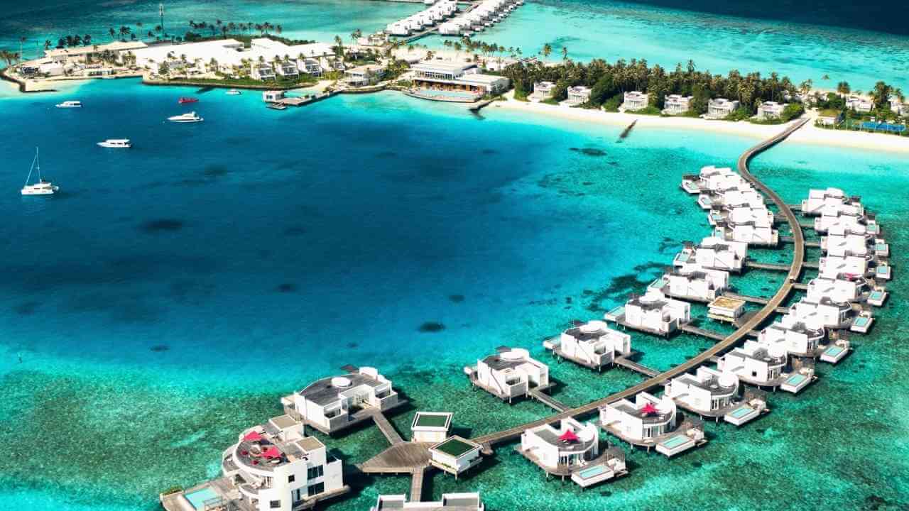 an aerial view of the overwater bungalows in the maldives