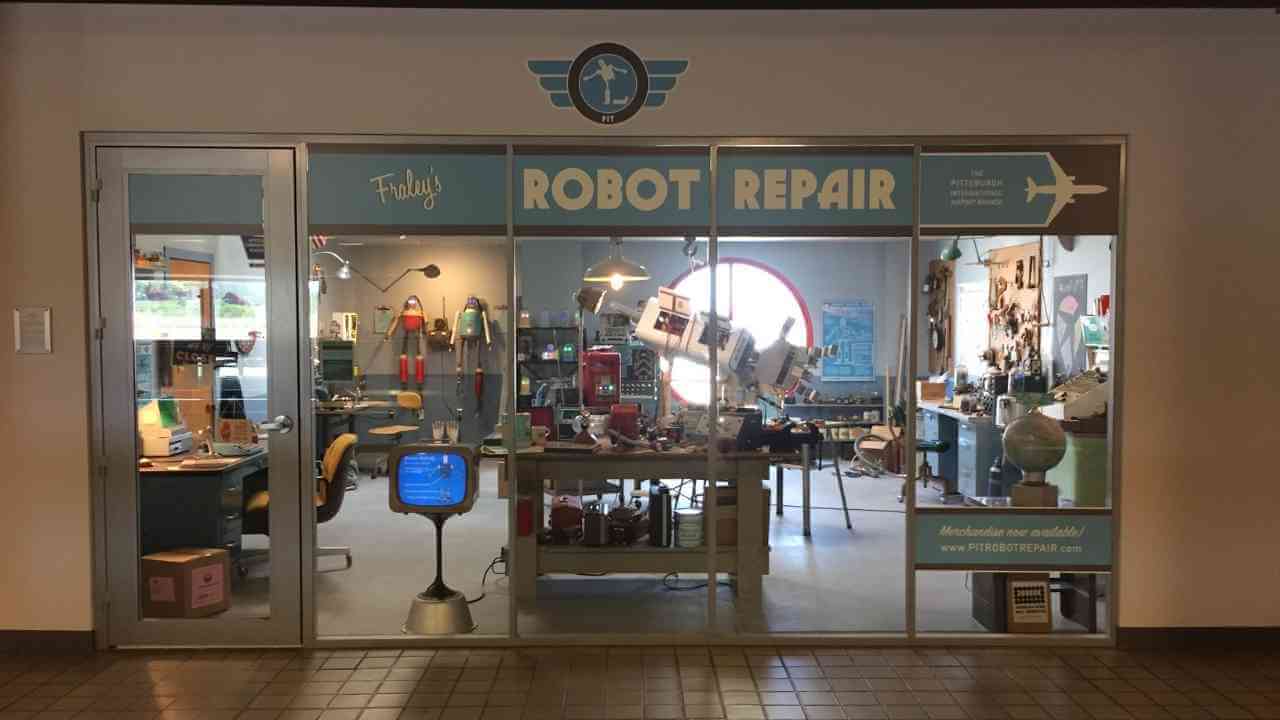 the front door of a shop with a sign that says robot repair