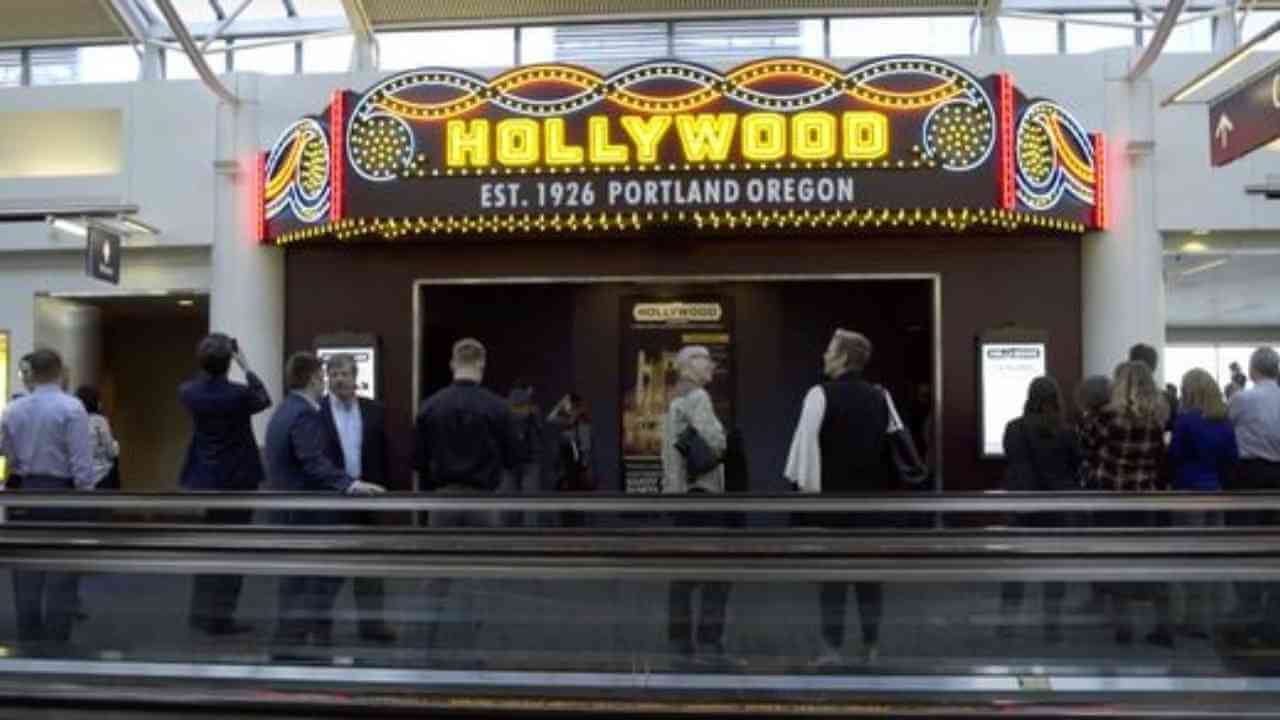 people are standing in front of a sign that says hollywood