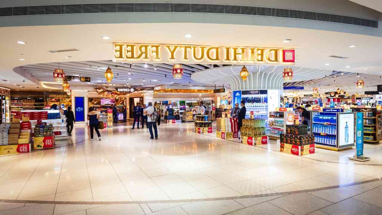 the inside of an airport with people walking around