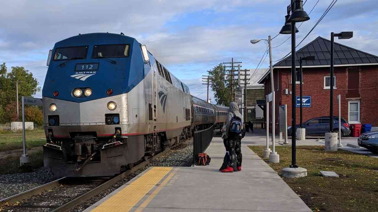 an amtrak train pulling into a station