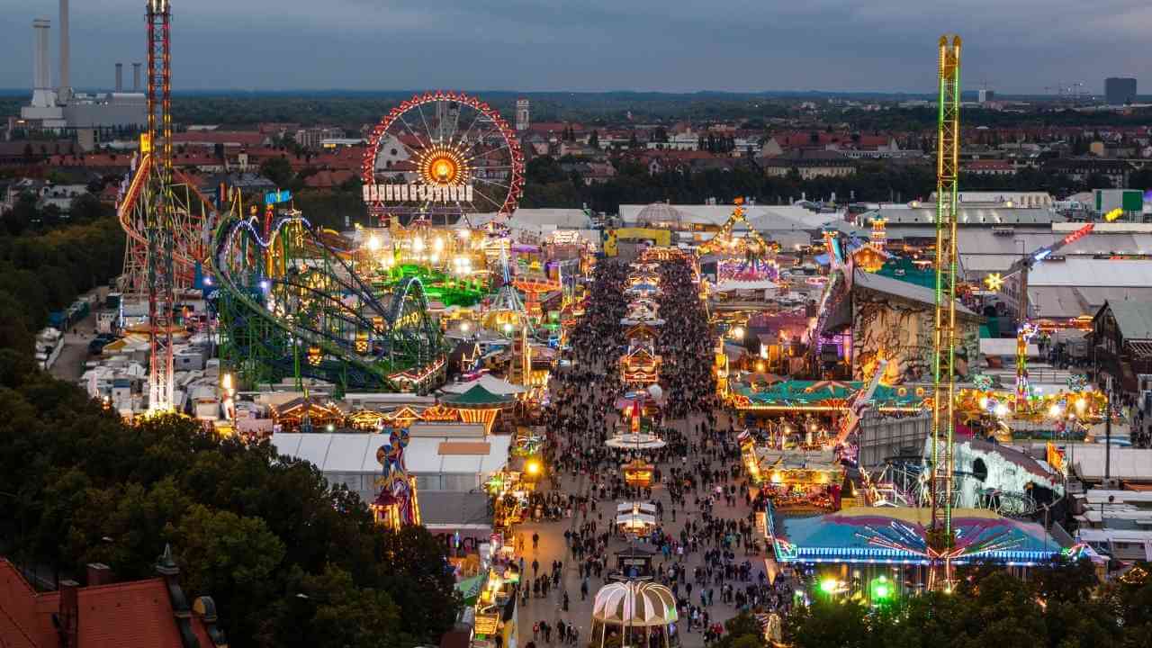 an aerial view of an amusement park at dusk