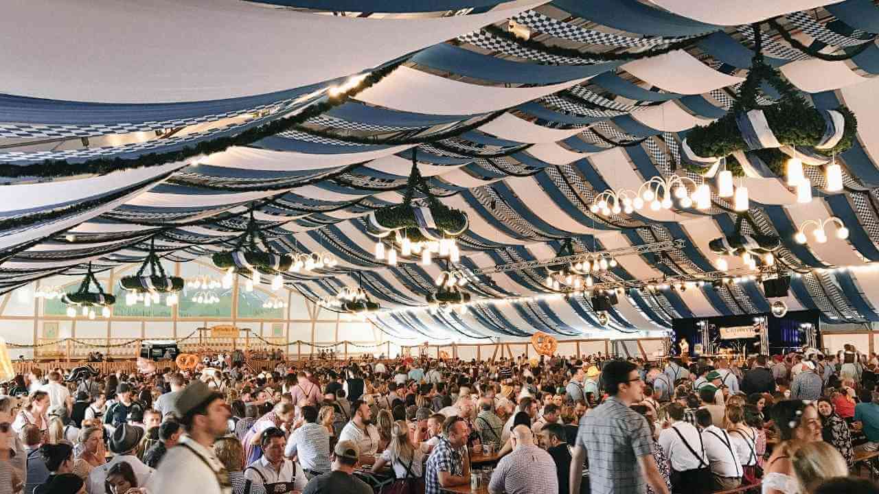 people under tent at oktoberfest in australia