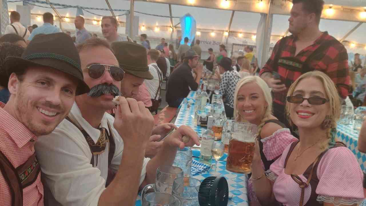 a group of people at an oktoberfest party