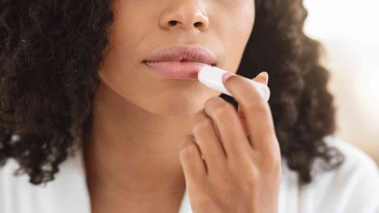 a person is brushing their teeth with a toothbrush