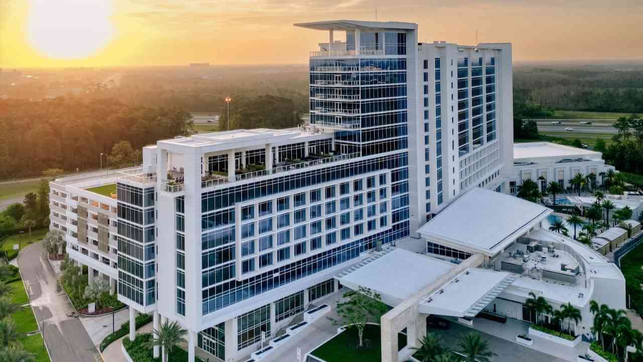 an aerial view of the hotel at sunset