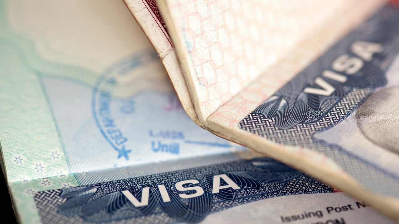 a close up of a visa and a passport