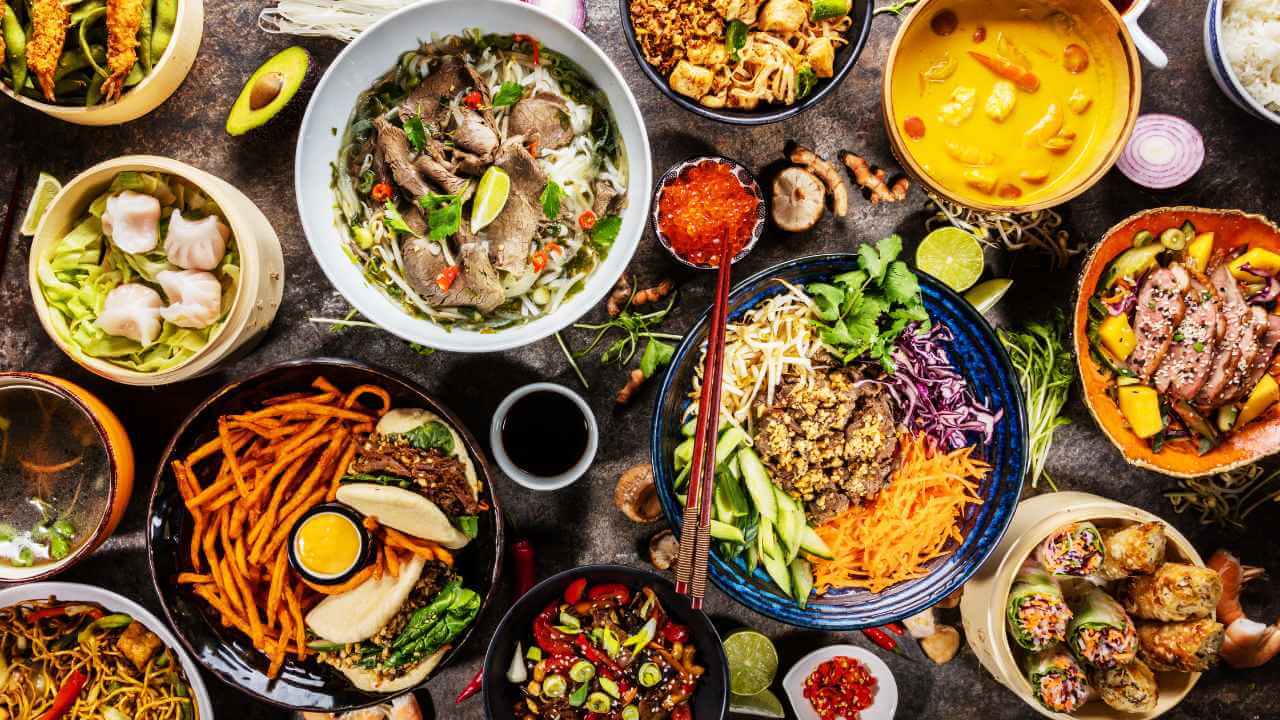 Various types of food are arranged on a table.