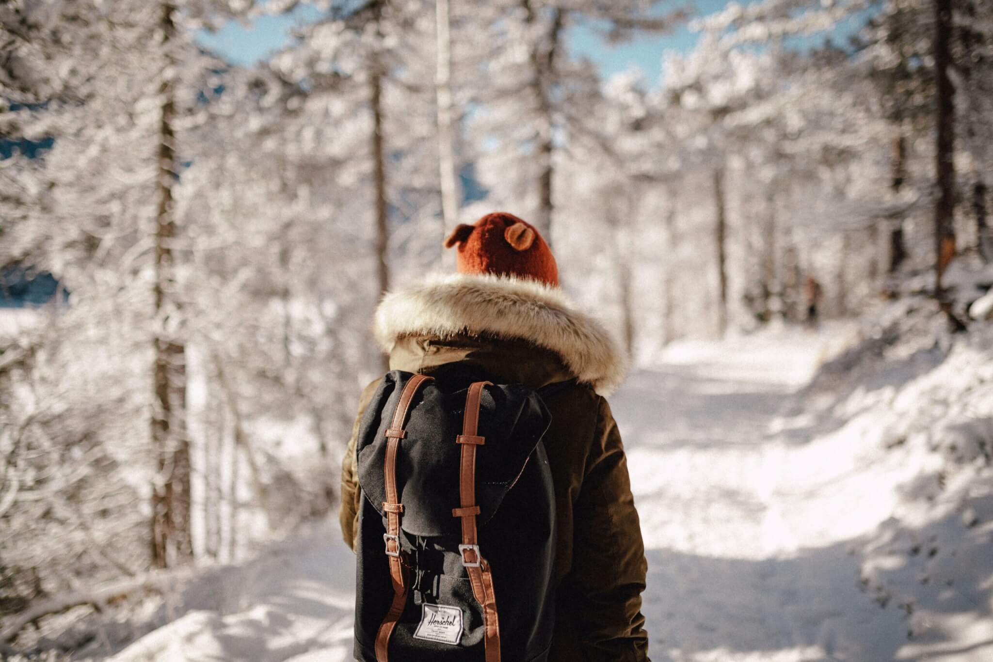 woman walking with backpack