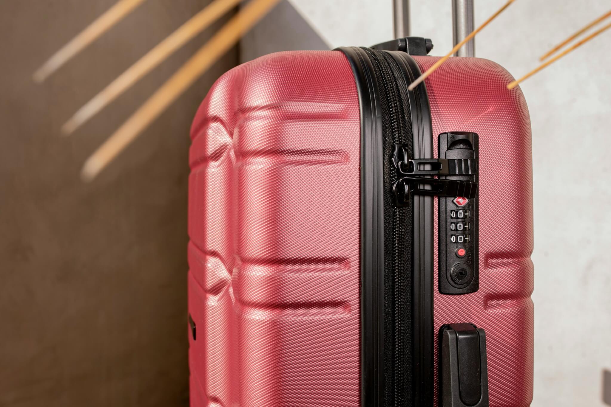 red rolling suitcase