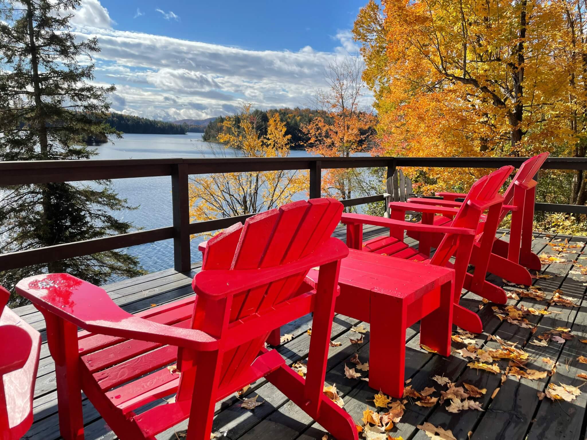 adirondack chairs on a lake