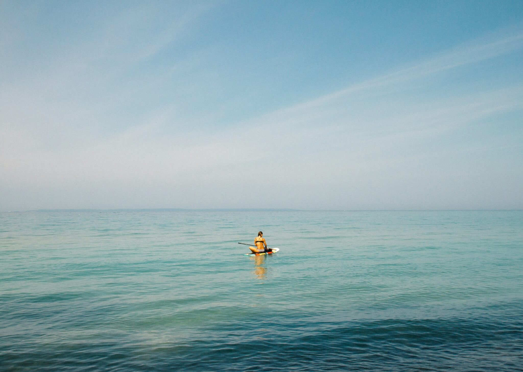 woman paddleboarding