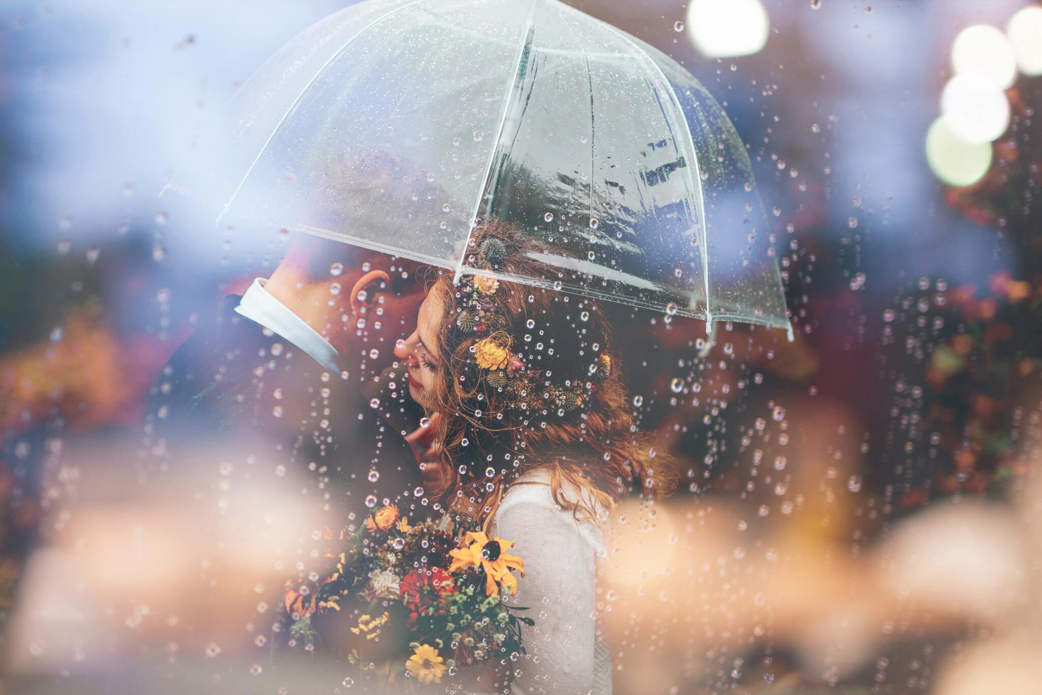 couple kissing in the rain