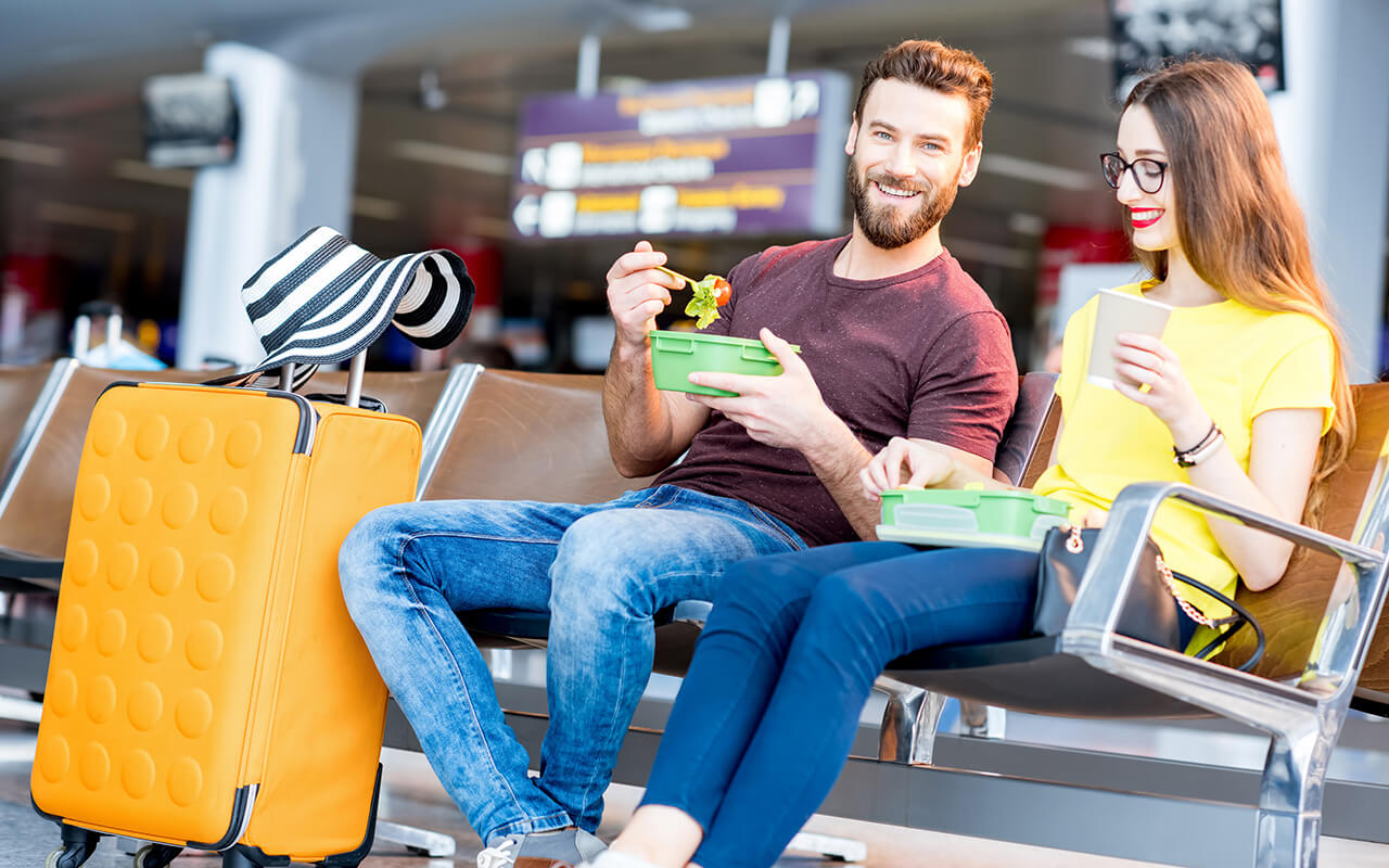 Couple eating at an airport