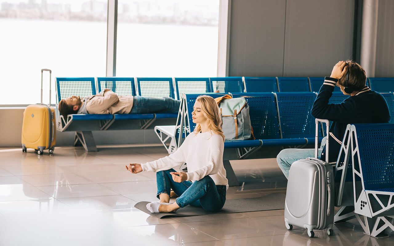 Woman meditating in the airport