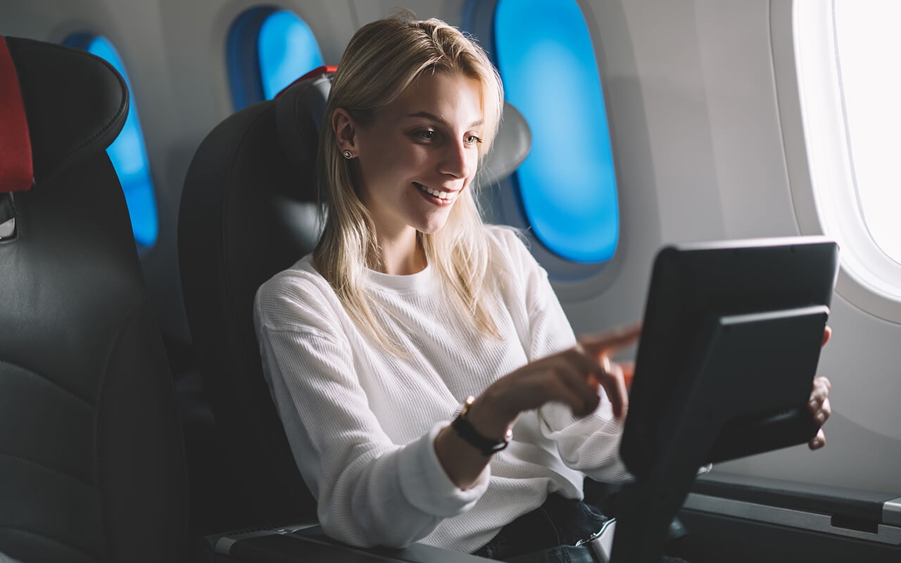 Woman watching in-flight entertainment 