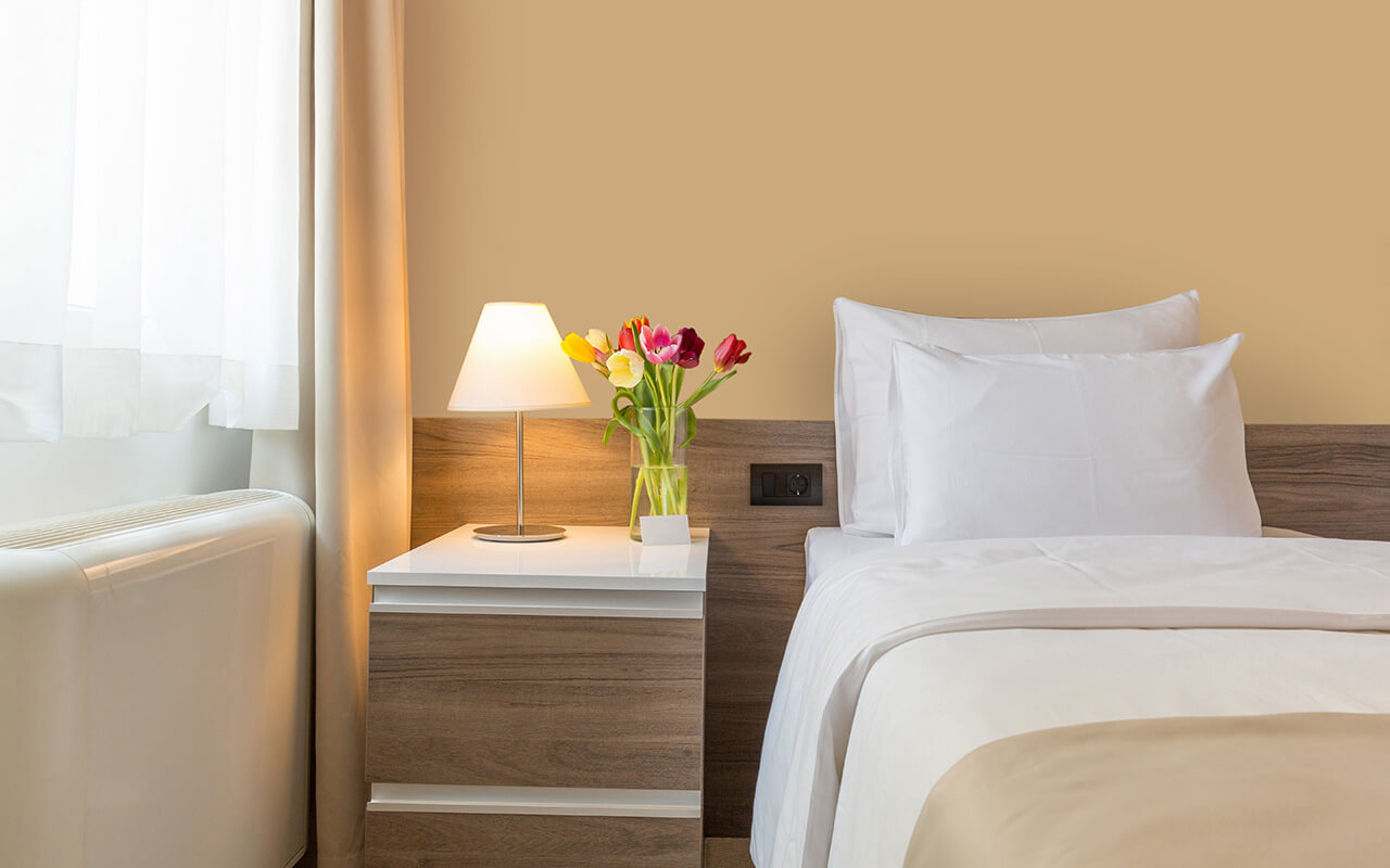 Lamp on end-table in a hotel room