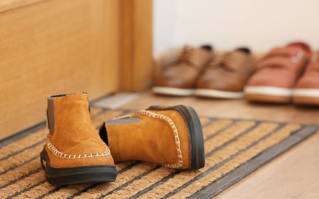 Shoes by the front door of a home