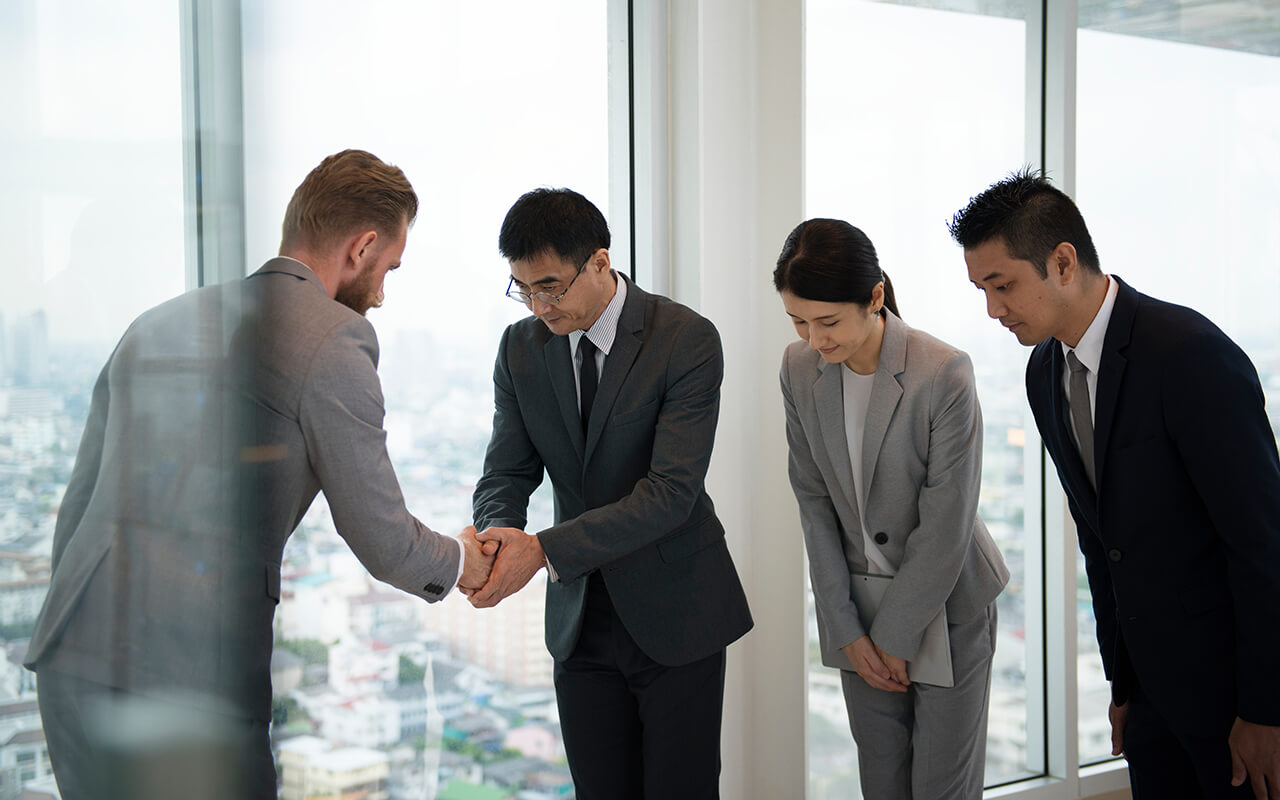 Business associates bowing in Japan