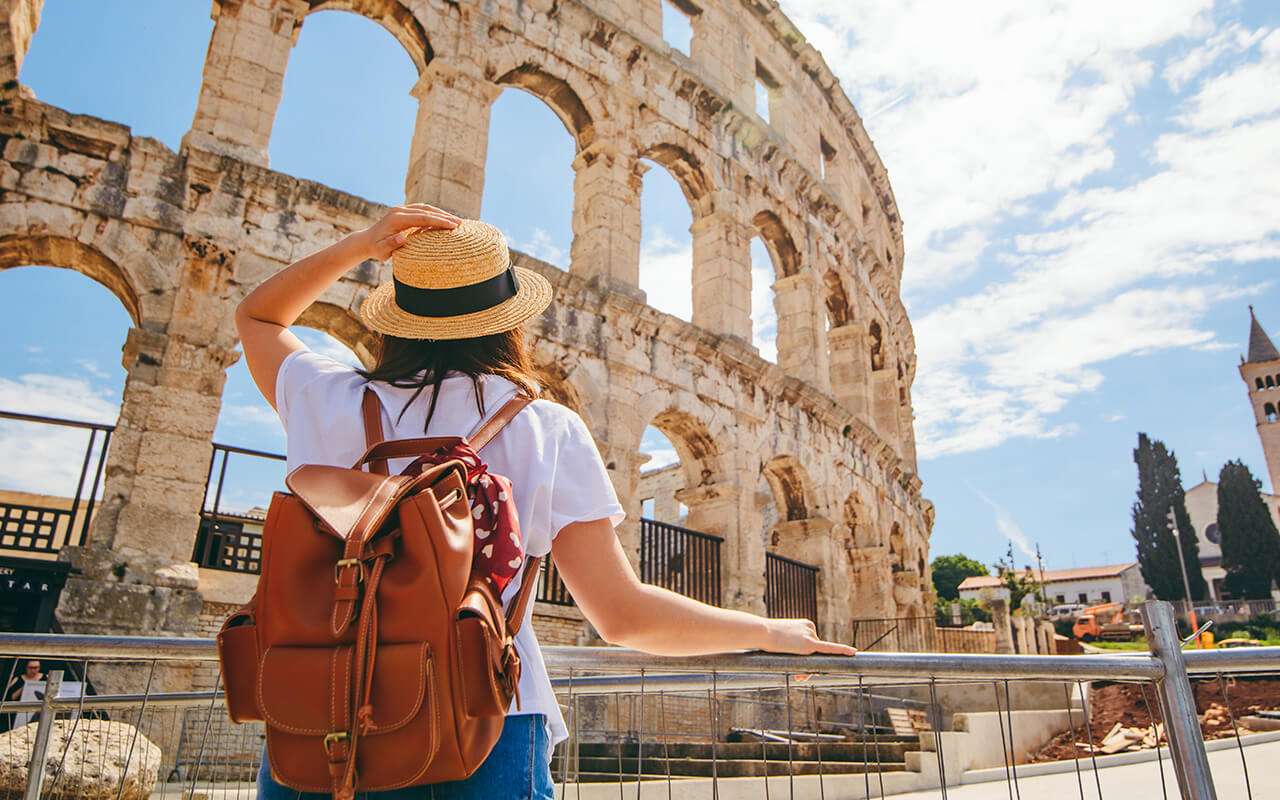 woman looking at coliseum in Pula, Croatia