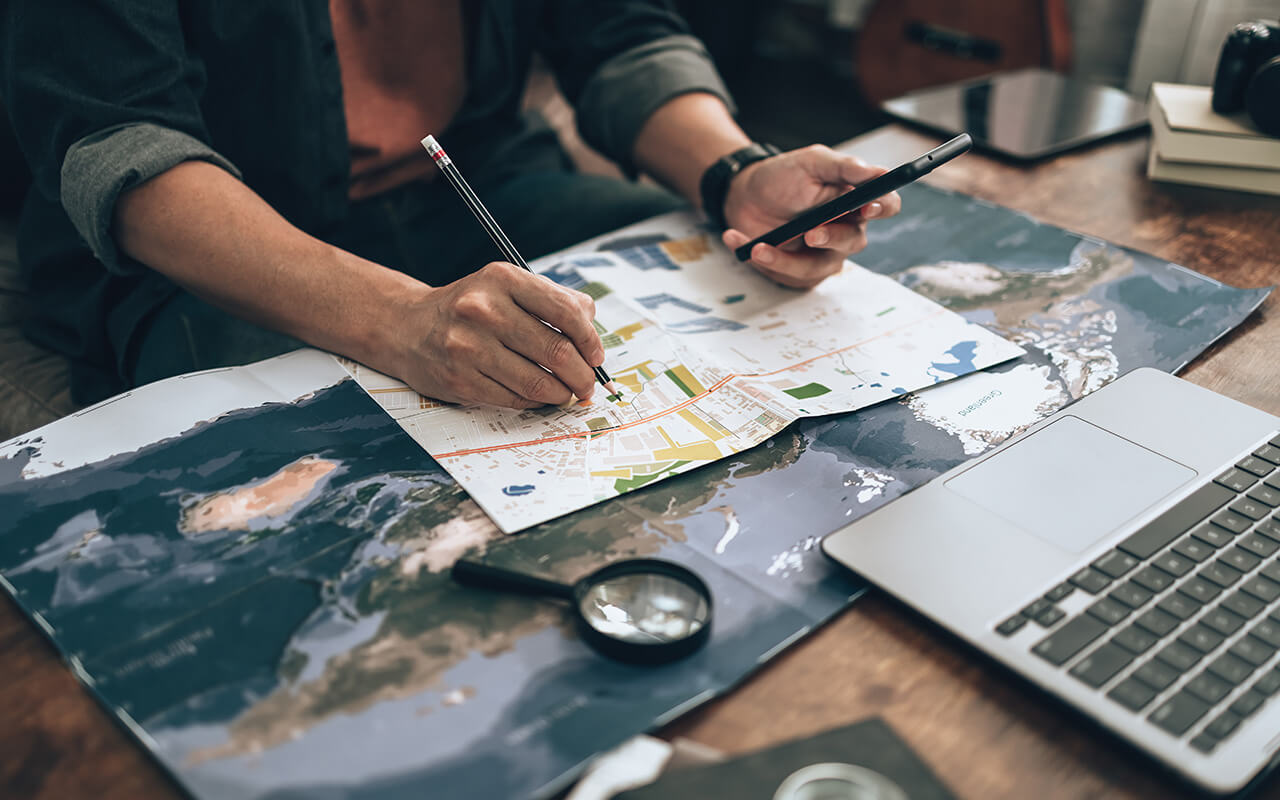 Man looking through maps