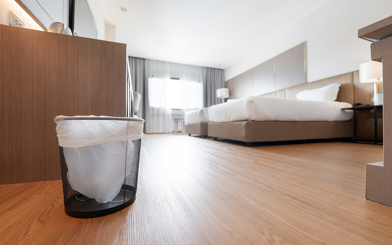 Hotel room interior with a trash bin