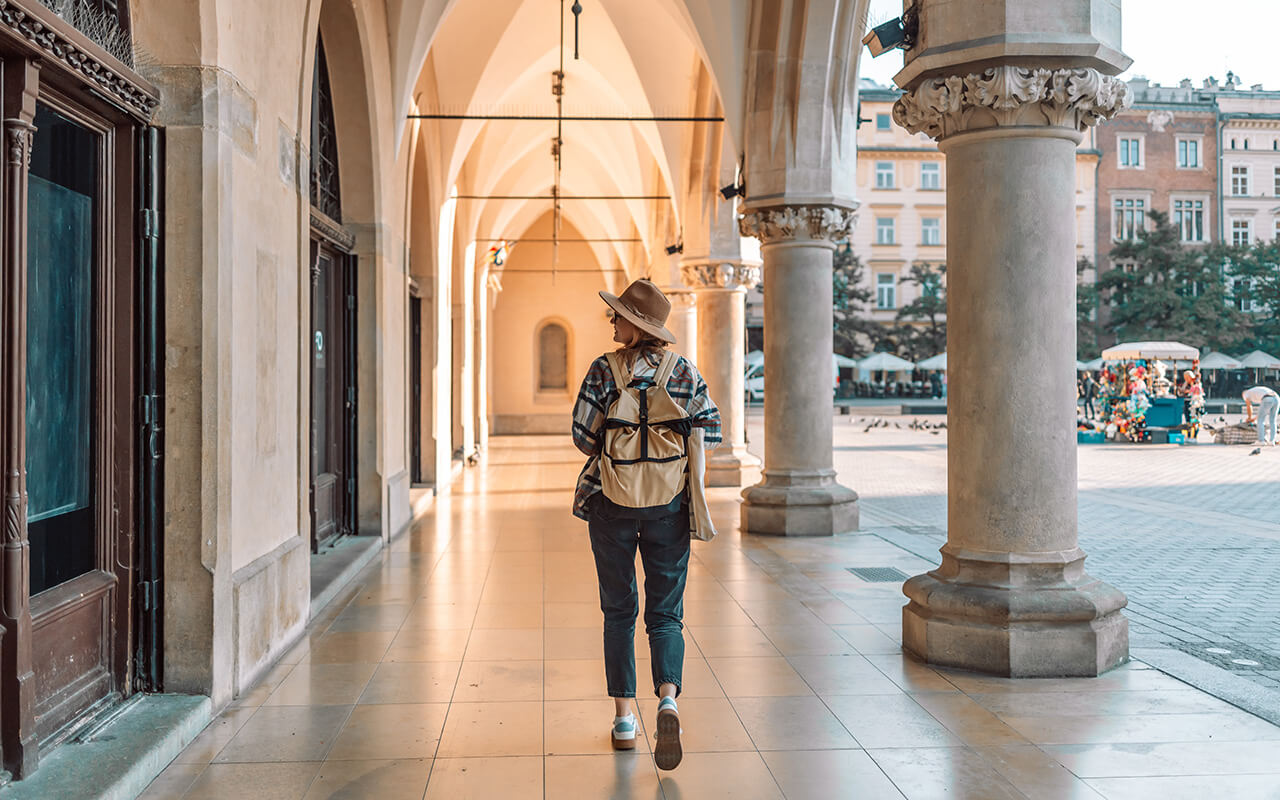 Woman traveling in city wearing a backpack 