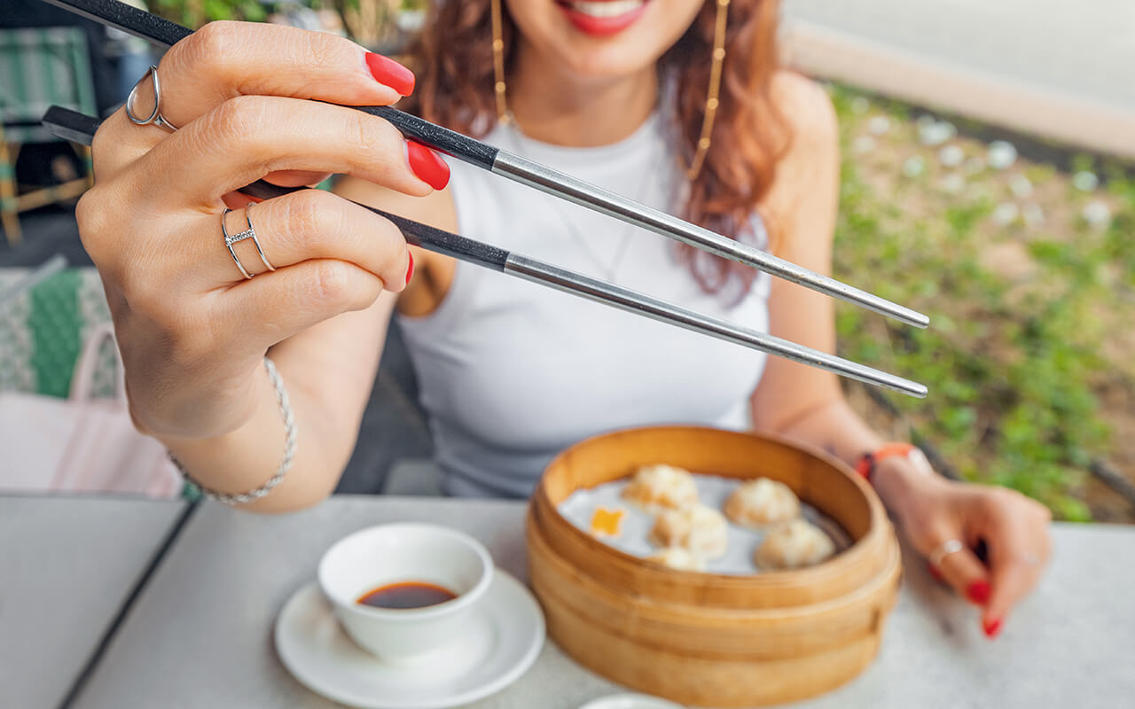 Woman using chopsticks