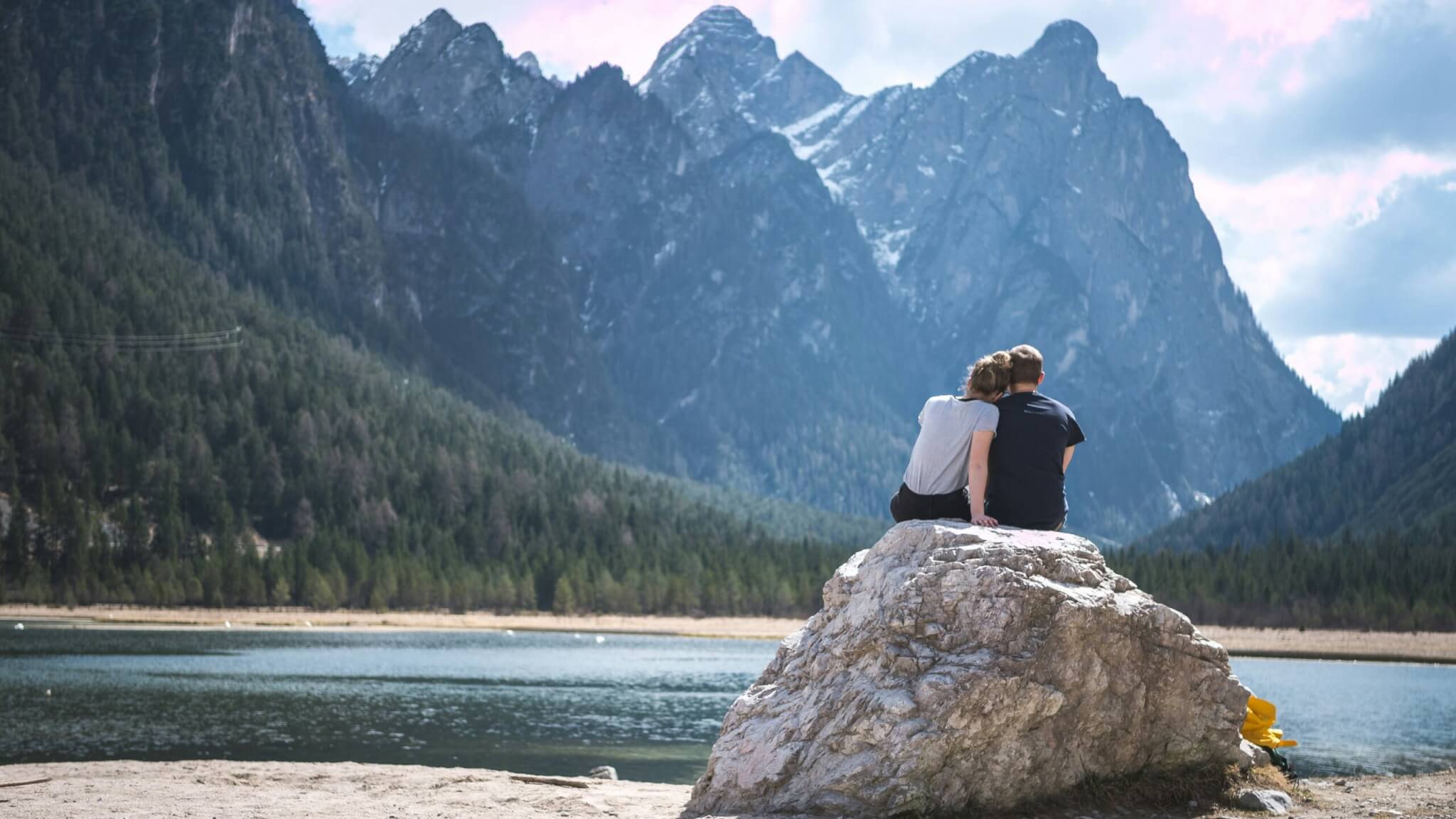 couple sitting on a rock