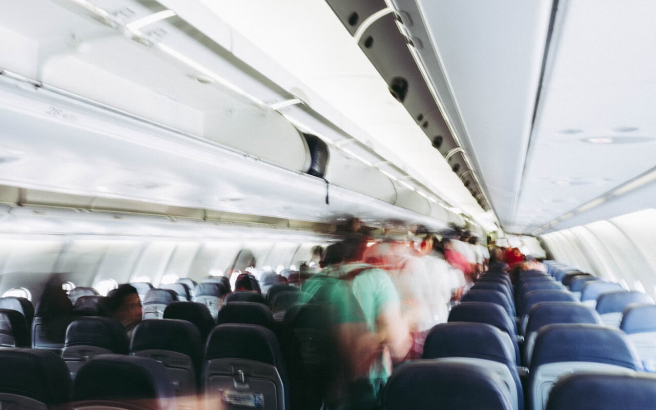 Passengers leaving an airplane