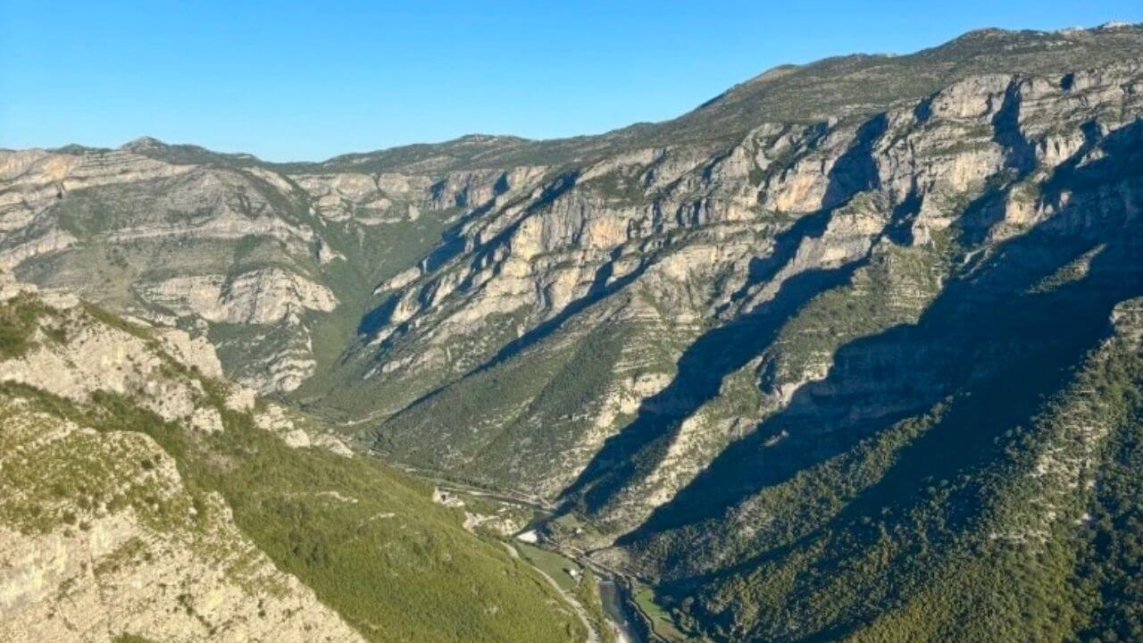 an aerial view of a valley in the mountains