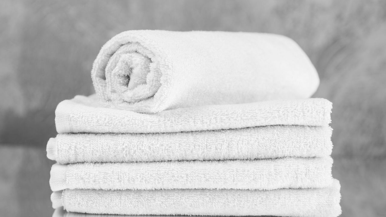 a black and white photo of a stack of towels