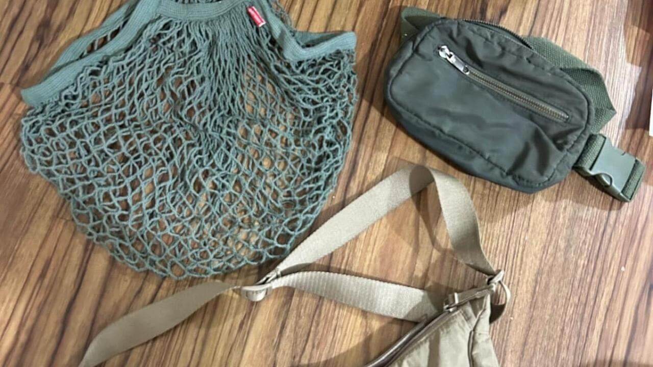 two bags and a purse sitting on a wooden floor