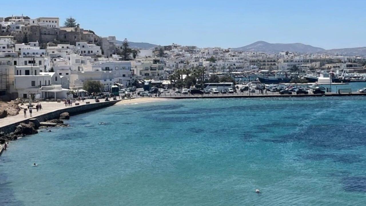 the view from the top of a hill overlooking the beach in mykonos, greece